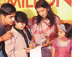 Smriti �Tulsi� Irani signs autographs 