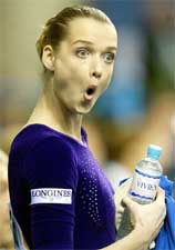Svetlana Khorkina of Russia reacts after performing in the women's uneven bars competition