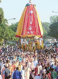 ISKCON devotees dance in front of the chariot of Lord Jagannath during a rath yatra in Chandigarh on Saturday