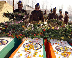 CRPF jawans on Saturday pay floral homage to their colleagues