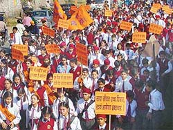 Students of DAV Public School carry banners during the "Jan chetna yatra", taken out by them on Saturday in Ludhiana