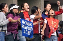 Tibetan activists shout anti-Chinese slogans