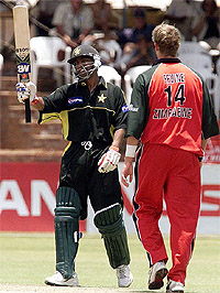 Pakistan batsman Yousuf Youhana celebrates scoring a century 