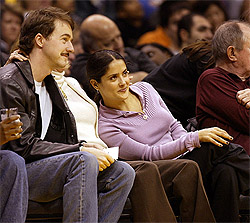 Actor Edward Norton and actress Selma Hayek watch the Los Angeles Lakers