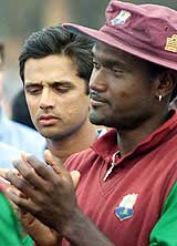 Indian captain Rahul Dravid watches as his West Indies counterpart Carl Hooper applauds