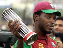West Indies player Chris Gayle poses with the Man-of-the-Series trophy