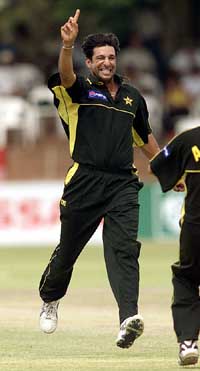 Pakistan's bowler Wasim Akram celebrates his dismissal of Zimbabwe batsman