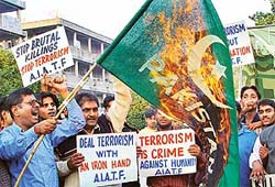 Activists of the All-India Anti-Terrorist Front, Chandigarh unit, burn the national flag of Pakistan, to condemn the terrorist attack on Raghunath Temple in Jammu, in Sector 17, Chandigarh