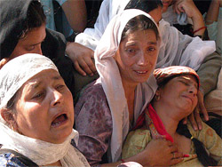 A woman cries for her dead husband