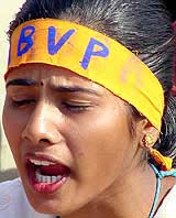 An ABVP supporter braves the sun and raise slogans