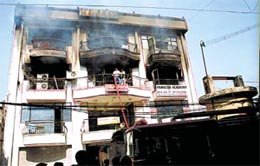 Smoke billowing out of the office-cum-shopping complex