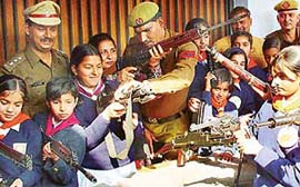 Girl guides of MRA School, Panchkula, being given a demonstration at Police Station, Sector 5, Panchkula by DSP Rajesh Duggal on Thursday.