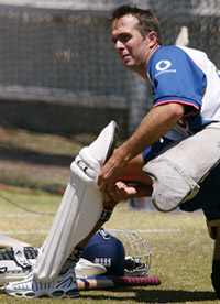 England opening batsman Michael Vaughan ties his pads on for a batting practice session on the eve of the third Ashes Test.