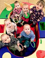 Russian children who live in a special orphanage for HIV/AIDS infected children look into the camera