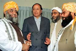 Powerbroker of the Pakistan Muslim League Quad-e-Azam Chaudhry Shujaat Hussain chats with MMA Secretary-General Fazalur Rehman