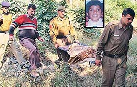 Police personnel take away the body of six-year-old Nihal (inset) whose body was found in Sector-29