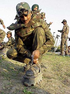 An Army jawan prepares himself for demining operation
