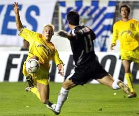 Leed United's Alan Smith lunges for the ball