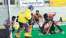 A tense goal mouth action during a match between CRPF and ONGC in the Shastri Hockey Tournament at the Shivaji Stadium on Saturday