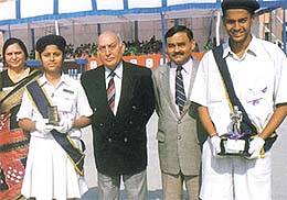 Air Marshal Ashok Goel, Air Commodore B K Banerjee and principal Mrs M Titus with S Venkatesh and Harsimaran Kalsi, who were adjudged the best athletes of the Air Force Bal Bharati School, during the annual sports day on Saturday