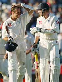 Richard Dawson and Michael Vaughan walk from the field 
