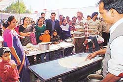 Visitors wait for their turn at one of the stalls at a South Indian food festival in Sector 46