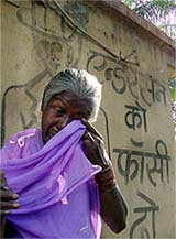 Radha, who lost three of her children in the 1984 Bhopal gas tragedy, weeps after a meeting with other victims in Bhopal