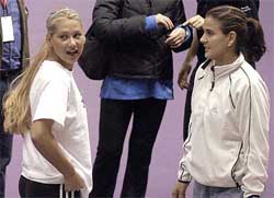 nna Kournikova of Russia and Conchita Martinez of Spain meet during training