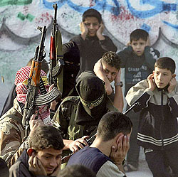 Palestinian boys cover their ears