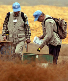 UN inspectors conduct a search for weapons of mass destruction at an agricultural facility near Baghdad on Sunday.