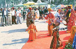Folk dancers of Rajasthan perform at model village at Agro-Tech, 2002, in Chandigarh on Monday.