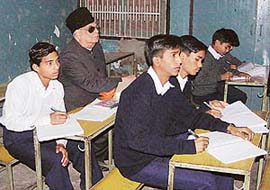 Lieut-Gen J.F.R. Jacob (retd) attends a mathematics class with students in Government Senior Secondary School, Dadu Majra, during a surprise visit, in Chandigarh on Monday. 