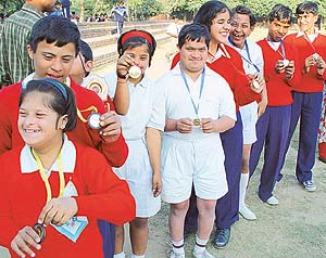 Mentally challenged children display their medals 