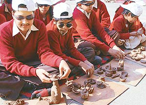 A student of The Institute of Blind, Sector 26, carves out the figure of Lieut-Gen J.F. R. Jacob (retd) out of clay 