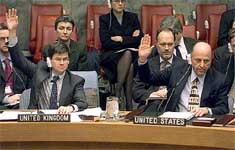 US Ambassador to the UN John Negroponte (R) and British Deputy Ambassador to the U. N. Adam Thompson (L) cast their votes