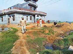 The house outside the village phirni that has been blocking the main drain of the village.�