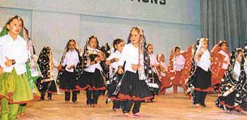 Schoolchildren present a Haryanvi dance during an annual function of Guru Nanak Public School