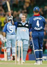 New South Wales opening batsman Michael Slater waves his bat to the crowd