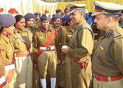 The IG, Mr Bhim Sen Bassi, and the SSP, Mr Parag Jain, interact with lady police constables at the farewell function held in Police Lines, Sector 26, Chandigarh, on Sunday.