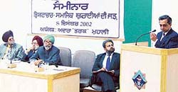 Mr Anupam Gupta speaks at a seminar on corruption in SAS Nagar on Sunday. Also seen in picture (from left): Dr H.S. Deol, Dr Prem Singh, Mr Puran Singh Kirti and Mr Ranjivan Singh.
