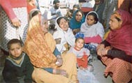 Grieving relatives of the victim, Rahul
