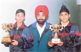 Gurbaksh Singh and Raj Kumar with their coach Gianinder Singh