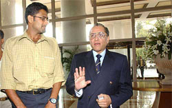 Anil Kumble and BCCI chief Jagmohan Dalmiya enter a hotel lobby for a meeting with representatives of the International Cricket Council 