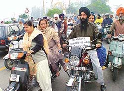 Activists of various Sikh bodies take part in a rally at SAS Nagar on Tuesday, defying the High Court orders on the wearing of helmets.