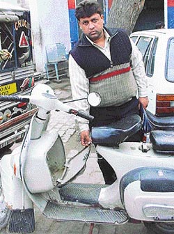 Mr Subhash Bansal shows the glove compartment of his scooter, which was broken and Rs 2 lakh stolen