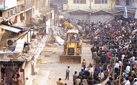 The MCD demolition squad in action at Central Market in Lajpat Nagar 