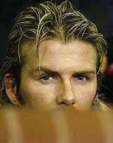 Manchester United�s David Beckham sits on the bench against Deportivo La Coruna during the Champions League 