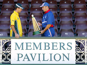 England captain Nasser Hussain gives Australia's one-day cricket team captain Ricky Ponting the triangular limited-over series trophy