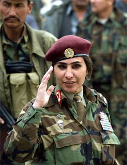 The only woman General in the Afghan army, Gen Khatul Myhammadzai, salutes during the funeral ceremony of Mahmood Shah
