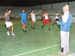 Dr S. Subramanian, coach of Punjab basketball team, with the cagers at a camp